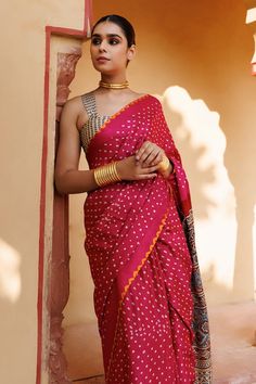 Magenta pink pure bandhani gajji silk saree with floral ajrakh hand block printed pallu and a yellow bandhani border around all edges. Comes with unstitched beige blouse piece with ajrakh hand block print. - Aza Fashions Pink Bandhani Chanderi Traditional Wear, Pink Art Silk Traditional Wear With Bandhani Print, Tussar Silk Saree Blouse Piece For Rituals, Festive Tussar Silk Traditional Wear With Bandhani Print, Navratri Pre-draped Saree With Traditional Patterns, Pink Slub Silk Saree For Navratri, Tussar Silk Saree With Bandhani Print For Puja, Festive Cotton Silk Saree For Rituals, Transitional Ritual Bandhani Traditional Wear