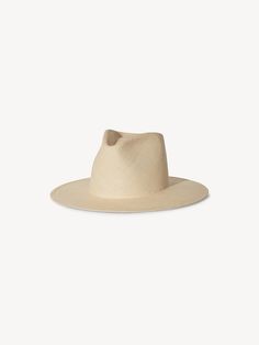 Details Greta is meticulously crafted from natural-toned Panama straw into a structured silhouette with a flat brim, conjoining sophistication and craftsmanship to create the ultimate straw staple. · Brim: 3.5"· Crown: 4.75"· Structured Panama Straw Fit Runs true to size. If between sizes, we suggest sizing up. Natural Fedora With Curved Brim In Toquilla Straw, Natural Toquilla Straw Fedora With Curved Brim, Elegant Hat With Structured Crown In Natural Color, Elegant Natural Hat With Structured Crown, Beige Toquilla Straw Fedora Panama Hat, Cream Wide Brim Straw Fedora, Beige Straw Panama Hat With Curved Brim, Straw Panama Hat With Curved Brim, Cream Fedora Straw Hat In Toquilla