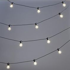 there are many lights that are hanging on the wire together, and one light is turned on