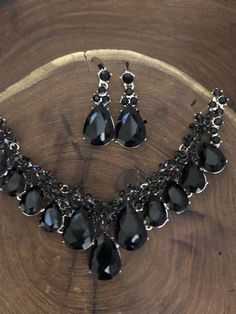 "These fun and stylish black teardrop cluster crystal rhinestone necklace and earrings set are a great statement piece! Size of earrings: 2\" Long. Necklace 17\"long with 3\" chain extender Decor Size: 1.75\" Color: black rhinestone Base metal color: silver More colors available upon request, just message us! Need a matching bracelet? https://www.etsy.com/listing/586175183/black-rhinestone-bracelet-black-crystal?ref=shop_home_active_6 https://www.etsy.com/listing/550147426/black-rhinestone-brace Black Teardrop Crystal Jewelry, Elegant Black Dangle Jewelry Sets, Black Jewelry Sets For Party, Black Drop Jewelry, Glamorous Black Diamond Jewelry, Black Teardrop Rhinestone Jewelry, Black Teardrop Jewelry With Rhinestones, Black Teardrop Drop Earrings For Party, Black Teardrop Earrings For Party