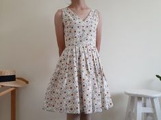 "Cream Floral Print Dress - Canvas fabric - Invisible nylon zipper on the back - Fixed waist - Fully lined - Pleated skirt - Ready to ship in 1-3 business days Measurements : Bust : 34\" Waist : 26\" Hips : free Total length : 35.5\" Shoulder to waist : 14.5\" Model height : 5'6\" bust : 33\" waist : 25\" hips : 35\" Please read the policies tab before purchase. I can't have a model for clothes of all sizes, but I have already clearly written a model size. If you have questions about the size, p Fitted A-line Cotton Sundress, Cotton A-line Sundress Sleeveless, Cotton V-neck Lined Sundress, Knee-length Cotton Dress With French Seams, Fitted Cotton Knee-length Sundress, Fitted Knee-length Cotton Sundress, Cotton V-neck Sleeveless Sundress, Fitted Cotton Sundress Lined, Fitted Cotton Sundress With Lining