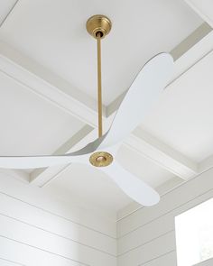 The Maverick 52 in Matte White w Burnished Brass features an 85.0 X 28.0 6-speed motor with a Thirteen-degree blade pitch. With a sleek modern silhouette, a DC motor, and super energy-efficiency, the 52" Maverick ceiling fan features softly rounded blades and elegantly simple housing. Maverick has a 52-inch blade sweep and a 3-blade design that delivers a distinct profile and incredible airflow for living rooms, great rooms, or outdoor covered areas. It includes a hand-held remote with six speed Maverick Ceiling Fan, Brass Ceiling Fan, 60 Inch Ceiling Fans, Living Room Ceiling Fan, Propeller Ceiling Fan, 52 Inch Ceiling Fan, Ceiling Fans Without Lights, Ceiling Fan Blades, White Ceiling Fan