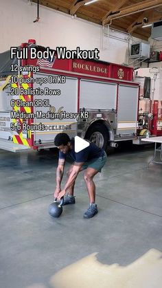 a man is doing kettlebell exercises in front of a fire truck