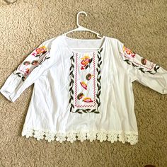 White, Embroidered Peasant Blouse, Never Worn. Pit-Pit 20”, Length From Shoulder 21”, Sleeve From Shoulder 13”. Folk Style Peasant Tunic Top With Floral Embroidery, Folk Style Peasant Top With Floral Embroidery, Peasant Floral Embroidered Top For Beach, Spring Peasant Top With Multicolor Embroidered Neckline, Casual Floral Embroidery Peasant Tunic Top, Multicolor Embroidered Peasant Top, Peasant Top With Multicolor Embroidery And Embroidered Hem, Peasant Style Embroidered Top For Vacation, Folk Style Peasant Top With Floral Embroidery For Beach