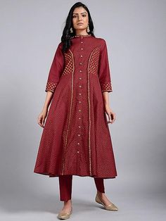 A red princess line kali kurta with 3/4th sleeves, hand block printed in gold, and details in gota. Features: Front open jacket dress with 3/4th sleeves Shell - pure cotton fabric Block printed in gold Side kali flare from waist to hem Handmade in India Measurements: Size XS : Bust-34", Waist-29", Hip-Flared, Shoulder-13", Length-47", Sleeve length-17" Size S : Bust-36", Waist-31", Hip-Flared, Shoulder-13.5", Length-47", Sleeve length- 17" Size M : Bust-38", Waist-33", Hip-Flared, Shoulder-14", Gold Long Sleeve Dresses With Gota Work, Designer Red Block Print Kurta, Red Block Print Kurta For Designer Wear, Red Block Print Kurta For Transitional Season, Transitional Red Block Print Kurta, Red Chanderi Kurta With Bandhani Print, Gold Long Sleeve Cotton Kurta, Chanderi Long Sleeve Block Print Dresses, Gold Anarkali With Printed Motifs