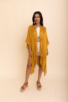 Flaunt your free-spirited style this summer with our Sun-kissed Breeze Frayed Trim Kimono! Perfect for vacations and weekend festivities, the kimono’s lightweight design is bound to keep you cool and comfortable. A layer of frayed trim along the borders adds an extra touch of texture and playfulness that is irresistible. The bright colors are bound to make you stand out so get ready to turn heads! Not only is it perfect for completing any beach-look, but also great to add a little extra flair to Flowy Casual Cover-up For Vacation, Casual Rayon Kaftan For Beach, Casual V-neck Cover-up For Festival, Spring Beachwear Flowy Kimono, Beach Tunic Kaftan In Rayon, Flowy Casual Cover-up For Beach Season, One Size Tunic Kaftan For Spring, Casual Flowy Vacation Cover-up, Breezy Beach Season Cover-up In Relaxed Fit