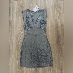 Silver And Grey Glamorous Silver Sleeveless Bodycon Dress, Silver Sequined Sleeveless Bodycon Dress, Silver Summer Club Dresses, Silver Club Dress For Summer, Sleeveless Silver Bodycon Dress For Summer, Gray Summer Party Dress, Fitted Sleeveless Silver Sequin Dress, Metallic Sleeveless Bodycon Dress For Date Night, Metallic Dress For Spring Club Events