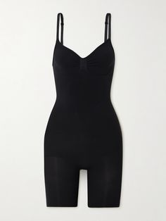 SKIMS' 'Seamless Sculpt' collection is designed to smooth and define the figure. Made from high-compression stretch fabric, this bodysuit has mid-length shorts and a scooped back, so you can wear it under low-cut dresses or tops. Black Compression Bodysuit With Built-in Bra, Compression Shapewear With Built-in Bra In Elastane, Black Sleek Shapewear With Built-in Bra, Fitted Seamless Workout Shapewear, Fitted Seamless Shapewear For Workout, Seamless Fitted Shapewear For Workout, Black Stretch Bodysuit With Seamless Construction, Black Stretch Shapewear Bodysuit, Elegant High-stretch Elastane Shapewear