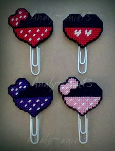 four minnie mouse hair clips with hearts on them