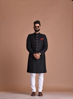 "Important Instructions : We request you to kindly calculate the processing time of your order after the mutual confirmation on Bespoke measurements between us has taken place (either via message , e mail or form) \"Crafted with Passion in India; loved by men across the USA, Canada, Europe\" Material: T R Color: Black Collar type: Mandarin , Sherwani with 7 Buttons Package contents: 1 Achkan + 1 Churidar Pajama Wash Care Instruction : Dry-clean only Achkans also known as Sherwanis were originate Black Achkan For Men, Traditional Black Suits For Ceremony, Black Long Sleeve Kurta For Wedding, Formal Black Set With Pallu, Black Festive Suits For Reception, Black Dabka Kurta For Wedding, Festive Black Suit For Reception, Traditional Fitted Kurta For Ceremony, Black Traditional Wear For Groom On Eid