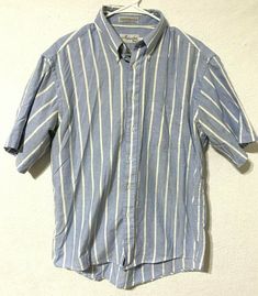 Brand: Mercedes by Enro Color: Blue/White Description: Mens short sleeve button up polo, striped Material Type: 60% combed cotton, 40% polyester Size: 16 1/2 Condition: Gently pre-owned in great condition.  Inventory Number: 20EE Fitted Cotton T-shirt With Button Closure, Striped Short Sleeve Polo Shirt For Summer, Light Blue Fitted Polo Shirt With Polo Collar, Fitted Light Blue Polo Shirt With Polo Collar, White Short Sleeve Polo Shirt With Button Closure, Fitted Light Blue Polo Shirt, Fitted Polo Shirt With Pockets For Summer, Light Blue Short Sleeve Polo Shirt For Summer, Fitted Summer Polo Shirt With Pockets