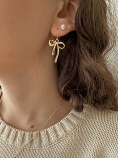 gold bow earrings – ivory moon Gold Earrings With Decorative Bow As Gift, Chic Gold Earrings With Decorative Bow, Chic Gold Earrings With Bow, Elegant Gold Earrings With Bow Tie Detail, Gold Dainty Bow Jewelry, Formal Gold Earrings With Decorative Bow, Dainty Gold Jewelry With Bow Detail, Dangle Bow Earrings For Gift, Gold Dangle Jewelry With Bow