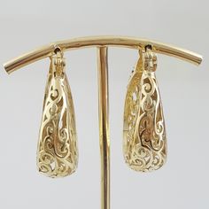 Step into the world of elegance and style with our stunning Gold Plated Filigree Hoop Earrings. Designed to make a statement, these earrings add a touch of glamour to any ensemble. Get ready to turn heads and feel fabulous!Inner diameter: 18mm - 11/16 in.Outer Diameter: 25mm - 1 in.Width at the bottom: 9mm - 3/8 in. Ornate Gold Filigree Hoop Earrings, Ornate Metal Filigree Hoop Earrings, Traditional Bronze Filigree Earrings, Brass Filigree Hoop Earrings, Antique Brass Filigree Earrings, Filigree Hoop Earrings, Gold Plate, Hoop Earrings, Plating