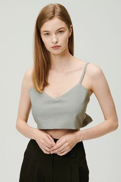 Sleeveless top Adjustable tie Crop length Unlined 60% Polyester 36% Rayon 4% Span Professional Clean Only / Do Not Tumble Dry Top: Bust: 47.5cm (18.7in) / Length: 23cm (9.1in) /Tie: Length: 85cm (33.5in) / Model's height is 7′ 5″ (170cm) Bust 32.5in Waist 23.5in Hip 34in and wearing Top Made in Korea 사이즈 정보Size information (단위:cm)(Unit : inch) FREETop 사이즈 정보 Size information 가슴Bust 47.518.7 총장Length 239.1 XTie 사이즈 정보 Size information 총장Length 8533.5 - 위의 실측사이즈는 '단면의 길이'입니다. 참고해 주세요.- 사이즈는 측정방법에 따라 1~3cm 정도 오차가 있을 수 있습니다.- 제품색상은 사용자의 모니터의 해상도에 따라 실제 색상과 다소 차이가 있을 수 있습니다. - The above measurement size is'length of section'. please note.- Depending on the measurement method, there may be an error of 0.5~1inch.- The product color may differ slightly from the actual color depending on the resolu The Us, Cami Top, Cami Tops, Basic Tank Top, Camisole Top, Sleeveless Top, Gray Color, Latest Trends, Tank Tops