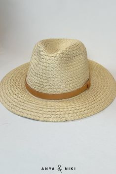 A must-have for any fashion-forward closet. The Favorite Hat is a natural straw panama hat that is the perfect outfit completer. Trimmed with an understated leather band, its modern look elevates sunny casual. Chic Natural Color Hat Bands For Beach, Chic Braided Straw Hat, Summer Fedora With Short Brim For Everyday, Chic Brown Fedora For Summer, Summer Fedora Hat Band In Straw, Casual Everyday Straw Hat With Curved Brim, Summer Fedora Hat Band Made Of Straw, Summer Fedora Hat Band, Classic Woven Panama Hat For Vacation