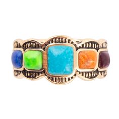 Experience the stunning beauty of genuine blue turquoise, vibrant lime green turquoise, rich purple turquoise, bright orange coral, deep lapis, and shimmering golden bronze in this colorful ring. Each stone is carefully placed across the top of the band, with the striking blue turquoise at the center. Weighing in at 5.1 grams and measuring .3" in length, this handcrafted ring is a true work of art. Let the bold and diverse colors of this ring inspire your senses and bring a touch of nature's beauty to your wardrobe. Turquoise Description: Turquoise is celebrated for its distinct blue-green color and veined patterns, with hues ranging from aqua blue to green depending on the copper and iron content. This ancient gemstone has been valued for millennia, often set in silver for jewelry and use Multicolor Turquoise Ring With Natural Stones As Gift, Multicolor Natural Stones Turquoise Ring In Bohemian Style, Unique Multicolor Adjustable Turquoise Ring, Multicolor Turquoise Ring With Natural Stones For Gift, Adjustable Multicolor Turquoise Ring In Southwestern Style, Multicolor Natural Stones Turquoise Ring Bohemian Style, Southwestern Style Multicolor Gemstone Rings, Unique Multicolor Rings With Natural Stones, Multicolor Bohemian Turquoise Ring With Natural Stones