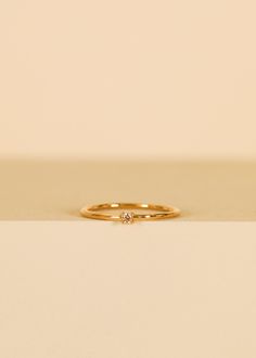 Perfect for making a subtle yet stylish statement. This elegant pinky ring features a dainty, champagne cz centerpiece with a sleek band that comfortably hugs the pinky finger, adding a touch of style to any ensemble. Champagne Cubic Zirconia18kt gold over brassBand width approx 1 mm Setting approx 2 mmSizes 3,4,5 Pinky Promise Ring, Pinky Finger Ring, Pinky Finger, Pinky Rings, Gold Pinky Ring, Crystal Stickers, Earring Stand, Jewelry Candles, Pinky Promise