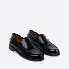 In rich, black Spazzolato leather, our College Loafer is bridging tradition and trend. Elegant, breathable, with padded insoles and a classic round toe. Pairs well with a mini skirt and a Harvard degree. Black Calf Leather Loafers With Stitched Sole, Classic Patent Leather Slip-on Loafers, Classic Calf Leather Slip-ons For Office, Timeless Black Slip-on Loafers, Luxury Slip-on Dress Shoes For Business Casual, Calf Leather Loafers With Brogue Detailing For Galas, Sleek Calf Leather Loafers With Branded Insole, Sleek Calf Leather Loafers With Leather Sole, Sleek Calf Leather Slip-on Loafers