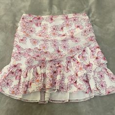 Never Worn New Condition Open To Offers! Feminine White Skort For Spring, Feminine White Skort For Day Out, White Skort For Brunch, White Ruffled Skort For Summer, White Ruffled Skort For Party, White Floral Print Skort For Vacation, White Floral Print Skort For Spring, White Floral Print Party Bottoms, White Ruffle Hem Skort For Summer