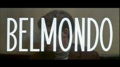 the words belmonddo are in front of a man's face