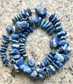 Size52cm (20.4 in) Materialnatural stoneVintage beads made of natural stone (lapis lazulisodalite), strung through Czech beads.year of manufacture1970sAll items are absolutely guaranteed to be genuine and as described. Buy with confidencewe are professional, fulltime dealers in business for many years. We pack and ship your purchases with care and consideration in a timely manner. With us, you can expect FirstClass service and helpful consultation at no extra charge.If you have any questions, wr Necklaces Beads, Vintage Beads, Vintage Necklaces, Czech Beads, How To Make Beads, Vintage Necklace, Lapis Lazuli, Natural Stone, Natural Stones