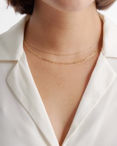 A delicate, chic classic that never goes out of style, a cable chain necklace is a must-have in every jewelry box. Even better: ours is made of 14k gold, justly priced, and looks great whether you’re layering it or wearing it solo. Silk Tee, Permanent Jewelry, Cable Chain Necklace, Linen Tank, Gold Bead Bracelets, Closet Staples, Fall Winter Style, Free Bag, Gold Beads