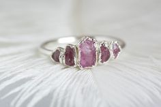 999 Pure Fine Silver Rough Pink Sapphire Gemstone Stacking Ring // Pink Sapphire Ring // Pink Gemstone Ring // Stackable Gemstone Rings // Gift This listing is for one raw pink Sapphire ring. No copper, no nickel, allergy free. Suitable for people with sensitive skin. DETAILS: Stone: natural pink raw Sapphire (heated) Stone size: centre stone approx. 6x4mm, smallest stones 3mm Metal: 925 silver base, electroformed in 999 silver and oxidized black or plated with 18k rose gold, 24k yellow gold or Pink Sterling Silver Stackable Jewelry, Pink Ruby Ring In Sterling Silver For Wedding, Pink Ruby Wedding Ring In Sterling Silver, Handmade Adjustable Pink Crystal Ring, Pink Stackable Rings For Promise, Pink Stackable Promise Rings, Pink Ruby Stackable Ring For Promise, Adjustable Pink Ruby Ring, Pink Stackable Ruby Ring For Promise