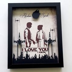 a clock that is on the side of a wall with an image of two people holding hands