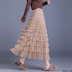 Peilia - Stylish Multi-layered Tulle Cake Skirt - High-waisted with Bold Flared Hemline Elegant Long Layered Skirt, Tiered Skirt For Spring Layering, Spring Tiered Skirt For Layering, Flowy Tiered Layered Skirt, Tiered Ruffle Skirt For Layering, Elegant Pleated Tiered Skirt, Elegant Tiered Pleated Maxi Skirt, Layered Long Skirt For Spring, Spring Layered Tiered Skirt