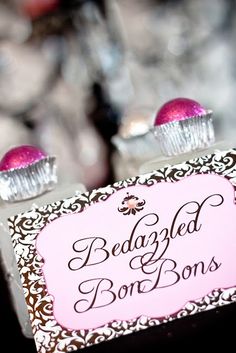 two small boxes with pink and white decorations on them