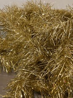 some gold tinsel sitting on top of a table