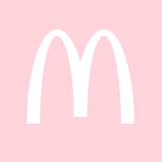 a white mcdonald's logo on a pink background