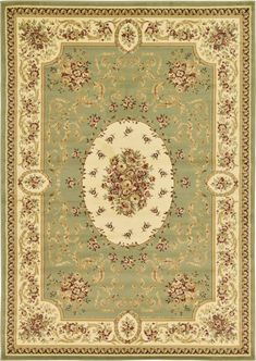 a rug with an oval design on the center and floral designs in green, beige and white