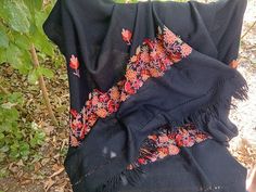 Soft Black Scarf with Floral Embroidery, Womens Wrap  🎓 Item Description & Materials 🎓 Very soft black long scarf with machine embroidered flowers  in bright colors  and 2 inches fingers for women. The scarf is not used and in very good condition 📏 Sizing 📏 Dimensions: 74 x 27 inches ( 2 inches fingers ) 188 x 68 cm ( 5 cm fingers ) All of the pictures are genuine and taken by me. You get the exact item in the pictures. If you have any questions or want additional pictures, please do not hesitate to ask. 🔎 Related Pieces🔎 For more vintage finding follow this link: https://www.etsy.com/shop/ClioVintageFinds?ref=shop_sugg_market Thank you for visiting my shop and supporting my little business ! Folk Style Shawl With Floral Embroidery, Traditional Floral Embroidered Shawl For Winter, Traditional Winter Shawl With Floral Embroidery, Festive Black Pashmina Shawl With Embroidered Border, Embroidered Black Shawl For Fall, Folk Style Black Shawl For Winter, Traditional Embroidered Winter Scarves, Black Bohemian Embroidered Fabric For Festivals, Black Embroidered Shawl For Fall