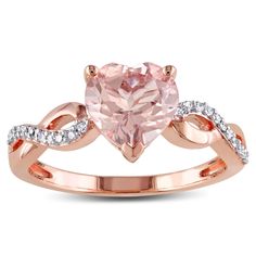 You are wearing modern beauty with this glamorous heart ring features a heart-cut morganite center stone and round white diamond side stones. Crafted in lustrous 10-karat rose gold, this dazzling ring is enhanced with a high polish finish. Heart Infinity Ring, Rose Gold Solitaire Ring, Rose Gold Morganite, Diamond Heart Ring, Morganite Diamond, Gold Solitaire Ring, Rose Gold Heart, Ring With Diamond, Twist Ring