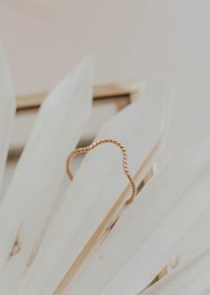 Originally designed to be paired with one of our Gemstone Rings, our Dune Ring stacks beautifully with any Stacking Bands and can hold it's own as a solo ring, too. Twisted wire is hand-shaped and made into a unique stacking ring. Available in 14kt Gold Fill + Sterling Silver. Handmade in Eau Claire, WI. Our jewelry is handmade so each piece will be unique and may vary slightly from what is pictured. Adjustable 14k Gold Jewelry With A Modern Twist, Adjustable Rings With A Modern Twist For Promise, Adjustable Promise Ring With A Modern Twist, Modern Twist Adjustable Promise Ring, Rose Gold Wire Wrapped Rings For Wedding, Rose Gold Wire Wrapped Wedding Rings, Modern Twist Stackable Toe Ring Jewelry, Minimalist Adjustable Crystal Ring For Promise, Modern Twist Stackable Promise Jewelry