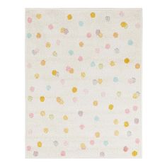 a white rug with multicolored polka dots on the front and back of it