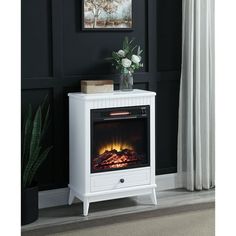 a white night stand with an electric fireplace