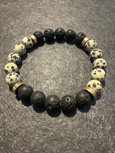 Balance  This stunning piece is handcrafted with the most exquisite stones. Dalmation Jasper and Lava Stone. Add it to your collection before it's gone. Dalmation Jasper, Lava Stone, Jewelry Tutorials, Gemstone Bracelet, Stretch Bracelet, Stretch Bracelets, Arm Band, Beading, Jewelry Bracelets