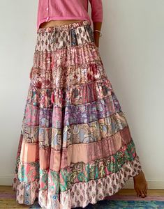 "This gorgeous colourful gypsie skirt is all fun to wear, boho style inspired long and flowy true hippy girl skirt it is made free size and floor length always one of a kind  patchwork, made of varieties of different fabrics with floral patterns,  very easy to wear and comfy  it has elasticated waist band, and will fit most of sizes S-L MEASURE One Size Fits Most length 39\"/100 cm waist 26-34\" CARE * Hand wash recommended * Hang to dry It is perfect outfit for everyday and evenings out or travels and festivals It is suitable to wear all year round with jumper and thights MATERIAL * Silk * Polyester * No lining  IMPORTANT NOTE  * Please note that colour shown on your monitor may vary from the colour of the fabric, due to light. If you have any doubts please contact us before purchuase." Bohemian Maxi Skirt With Ruffles, Summer Maxi Skirt With Gathered Detail, Hippie Ruffled Maxi Skirt For Festivals, Hippie Ruffled Maxi Skirt, Hippie Style Maxi Skirt With Ruffles, Bohemian Flowy Maxi Skirt For Spring, Bohemian Spring Maxi Skirt, Festival Tiered Skirt Dress, Festival Tiered Ruffled Maxi Skirt