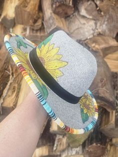 Handpainted sunflowers adding a unique accent to professionally beaded brim of a nice light Grey polyester fedora. A black ribbon adds a little bit of a color cut to this absolutely eye catching hat! Make it yours today or message me for a custom order! Beaded Sunflower, Beaded Hats, Beaded Items, Hat Bands, Beaded Hat, Craft Corner, Black Hat, Black Ribbon, Hat Band