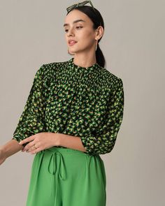 Details: 
- Model is 5 8½, wearing a Size S Model's measurements: Bust - 31.9'', Waist - 24'', Hips - 35.4'' - Mock Neck - Floral print - Puff Sleeve Blouse - Ruched - Loose Fabric: It is made of Polyester and Elastane. Polyester is a man-made fiber that feels soft, looks lustrous, and dries fast. It's also durable, with its good resistance to wrinkles, stains, and sunlight. Elastane has good acid and alkali resistance, sweat resistance, seawater resistance, dry cleaning resistance, and abrasion Casual Green Tops With Gathered Sleeves, Green Puff Sleeve Smocked Top, Green Summer Blouse With Smocked Cuffs, Summer Green Blouse With Smocked Cuffs, Spring Workwear Blouse With Smocked Bodice, Fitted Green Blouse With Gathered Sleeves, Green Smocked Top With Smocked Cuffs For Fall, Green Long Sleeve Smocked Top With Smocked Cuffs, Spring Ruched Workwear Blouse