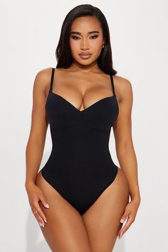 Available In Black And Nude. Super Strong Support - Powerful sculpting for maximum definition Shapewear Bodysuit Adjustable Straps Padded Wireless Bra Cups Waist Compression Panel Thong Bottom Hook And Eye Closure Stretch Final Sale Self: 88% Nylon 12% Elastane Imported | Hourglass Figure Compression Shapewear Bodysuit in Black size Medium by Fashion Nova Sleek Black Compressive Shapewear, Compressive Black Shapewear With Lined Body, Sleek Black Shapewear With Built-in Bra, Sleek Micro-elastic Black Shapewear, Black Seamless No-show Shapewear, Shapewear Bodysuit, Bra Cups, Black Bodysuit, Matching Dresses