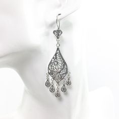 Handmade 925 Sterling Silver Artisan Crafted Filigree Teardrop Chandelier Earrings  Material: 925 Solid Sterling Silver, 925 Stamped Earrings Length: 3 inches Earrings Width: 0.75 inches Closure: Ear wire with safety catch Finishing: Oxidized and Polished Comes with a gift pouch and box. Free Domestic Shipping We hope that you enjoy our exclusive artisan handcrafted jewelry. Filigree Teardrop Chandelier Earrings, Teardrop Filigree Chandelier Earrings, Elegant Silver Teardrop Crown Earrings, Bohemian Sterling Silver Teardrop Chandelier Earrings, Bohemian Teardrop Sterling Silver Chandelier Earrings, Sterling Silver Intricate Teardrop Earrings, Classic Filigree Dangle Chandelier Earrings, Sterling Silver Teardrop Earrings With Intricate Design, Ornate Sterling Silver Chandelier Earrings