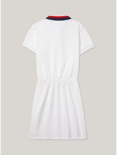 Tommy Hilfiger girls’ dress. Year after year, our polo dress remains a best-seller. And for good reason—it��’s cute, comfy and stands up to many a washing machine tumble. Part of our Adaptive Collection, designed for ease of dressing in classic Tommy style.  Material: 97% Better Cotton Initiative (bci) Cotton, 3% Elastane. White Short Sleeve Tennis Dress, White Sporty Short Sleeve Tennis Dress, Sporty White Short Sleeve Tennis Dress, Classic Cotton Polo Dress For Summer, White Fitted Casual Polo Dress, Classic White Polo Dress For Spring, Preppy Collared White Dress, Preppy White Collared Dress, Sporty Cotton Dress With Short Sleeves