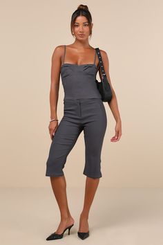 Everyone will envy your oh-so-chic look when you're wearing the Motel Sawil Charcoal Grey Mid-Rise Capri Trouser Pants! Stretchy woven fabric shapes these on-trend pants that have a mid-rise fit with a banded waist and a hidden zip fly with a top clasp closure. Fitted legs continue down to chic, capri-length hems with a slight flare. Pair with the matching top for a complete look! Fit: This garment fits true to size. Length: Knee Length. Size medium Inseam: 17.50 Front Rise: 9.00 Waist: Fitted - Chic Cropped Bottoms With Pockets, Fitted Wide-leg Summer Capris, Chic Knee-length Summer Pants, Chic Summer Knee-length Pants, Fitted Workwear Capri Pants, High Waist Capris For Summer, Chic Cropped Leg Bottoms For Day Out, Chic Cropped Fitted Bottoms, Fitted Capri Length Work Pants