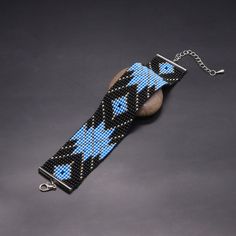 a blue and black beaded key chain