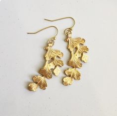 Brass Natural Looking Textured Oak Leaf Cluster Dangle Earrings, Boho Whimsical Botanical Jewelry, Acorn, Tree, Fall Style, Everyday Wear Wonderfully whimsical and has a lovely amount of wavy movement, these brass leaf earrings are textured and detailed. They measure 1.5" and dangle from French ear wires. Shipping We are dedicated to shipping your order as quickly as possible! All orders will ship within 1-3 business days. All orders are shipped with tracking information vis USPS First Class mai Acorn Tree, Boho Whimsical, Customer Card, Dangle Earrings Boho, Bold Jewelry, Botanical Jewelry, Wire Work Jewelry, Leaf Jewelry, Work Jewelry