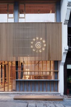 the outside of a building with wooden slats