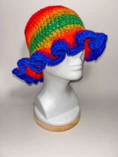 Add a splash of color to your outfit with our Burnt Rainbow Frill Bucket Hat! This unique accessory features a delightful blend of earthy rainbow hues, complemented by a charming frilly brim that adds a touch of whimsy to your look. Features: *Unique Design: Burnt rainbow colors for a vibrant and earthy aesthetic. *Charming Frill: A frilly brim that adds a playful and feminine touch. *Summer-Ready: Lightweight and breathable material ensures you stay cool and comfortable. *Sun Protection: Brim p Trendy Multicolor Bucket Hat For Spring, Trendy Multicolor Bucket Hat With Curved Brim, Trendy Multicolor Bucket Hat With Short Brim, Trendy Multicolor Curved Brim Bucket Hat, Colorful Spring Bucket Hat, Colorful Sun Hat With Curved Brim For Spring, Multicolor Brimmed Mini Hats In Yarn, Colorful Bucket Hat For Spring, Colorful Curved Brim Sun Hat For Spring